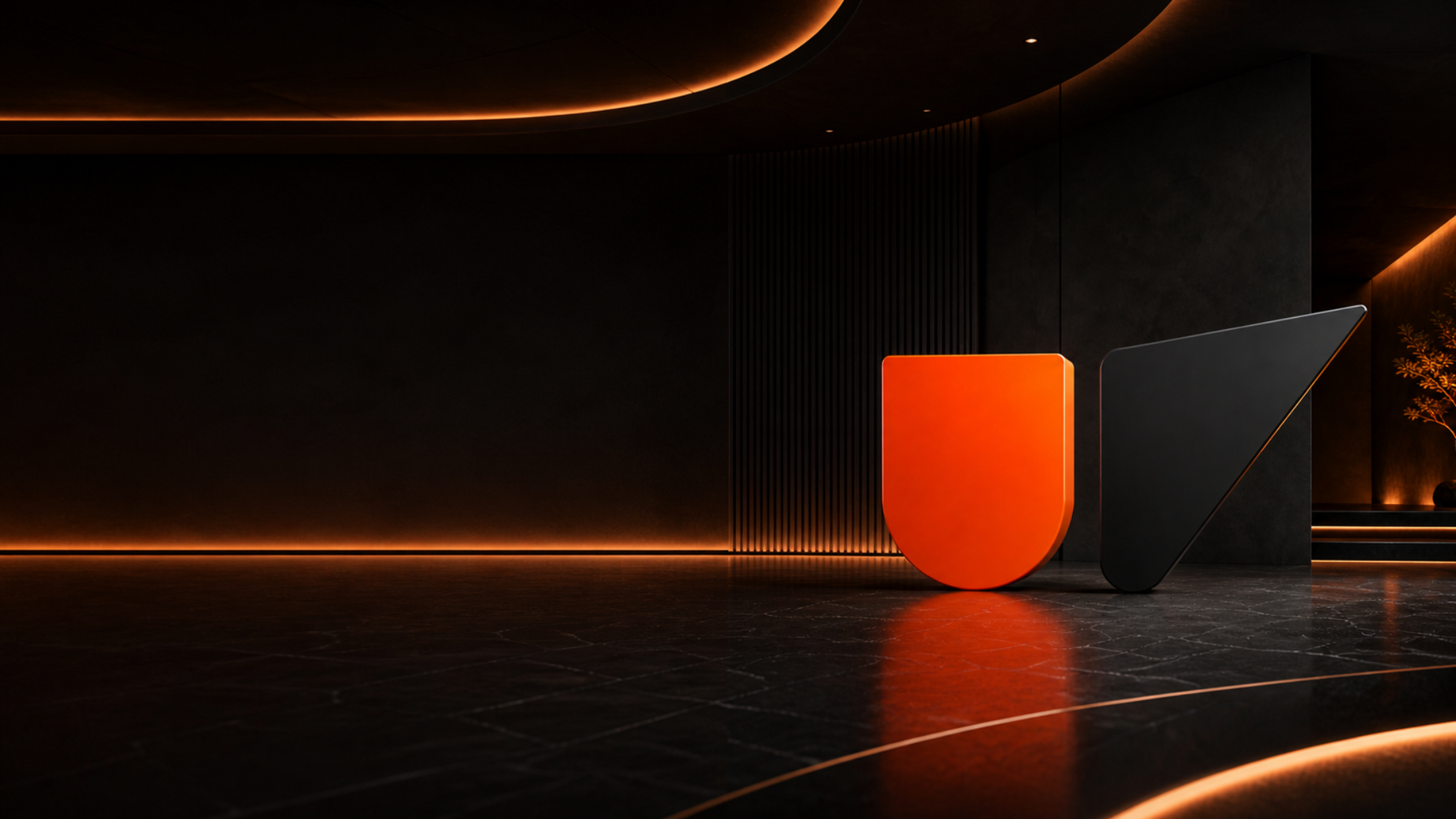 Sculptural orange U and black V monolith in a dimly lit gallery space